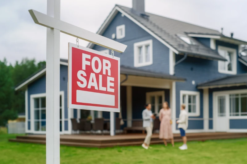 For Sale sign in front of a home.